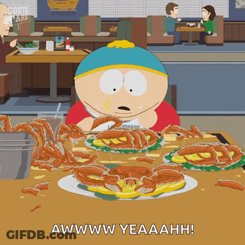 A Cartoon Character From South Park Is Sitting At A Table With A Bunch Of Food GIF