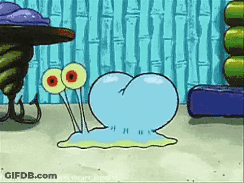 A Cartoon Character From Spongebob Squarepants Is Crawling On The Sand GIF