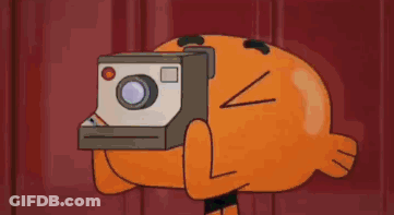 A Cartoon Character From The Amazing World Of Gumball Is Holding A Polaroid Camera . GIF