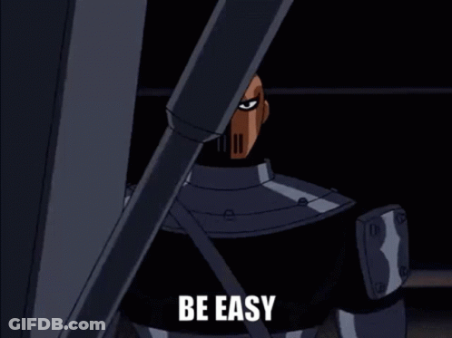 A Cartoon Character From The Batman Animated Series Is Standing In A Dark Room . GIF
