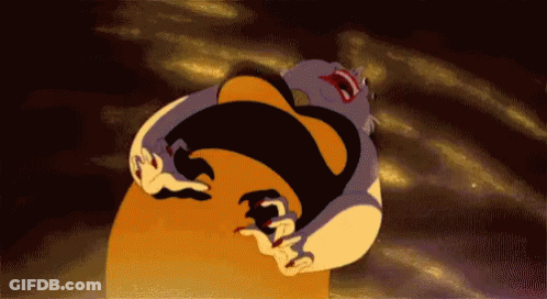A Cartoon Character From The Little Mermaid Is Laying On A Large Orange Ball . GIF