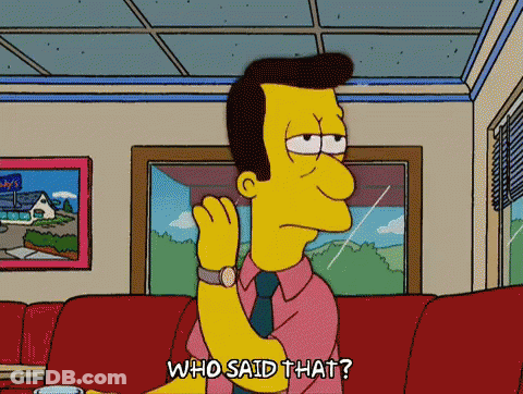 A Cartoon Character From The Simpsons Is Sitting On A Couch And Saying " Who Said That " GIF