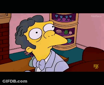 A Cartoon Character From The Simpsons Is Sitting On A Couch In Front Of A Fireplace GIF