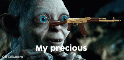 A Cartoon Character Holding A Gun With The Words My Precious Below Him GIF