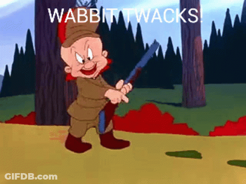 A Cartoon Character Holding A Gun With The Words Wabbit Twacks Written Below Him GIF