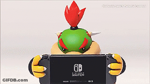 A Cartoon Character Holding A Nintendo Switch In His Hands GIF