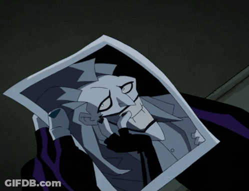 A Cartoon Character Holding A Piece Of Paper With A Joker Face On It GIF