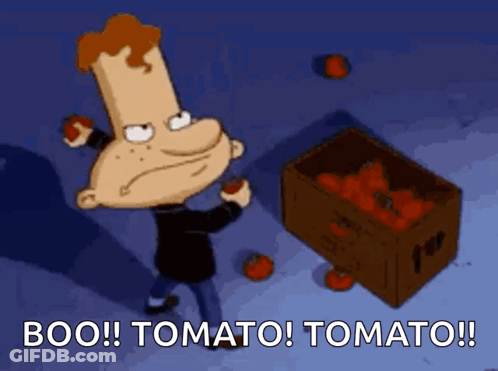 A Cartoon Character Holding A Tomato Next To A Box Of Tomatoes That Says Boo Tomato Tomato GIF