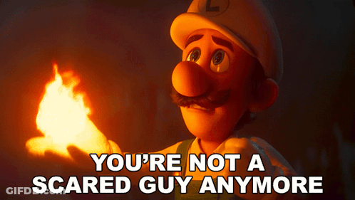A Cartoon Character Holding A Torch With The Words " You 'Re Not A Scared Guy Anymore " Above Him GIF