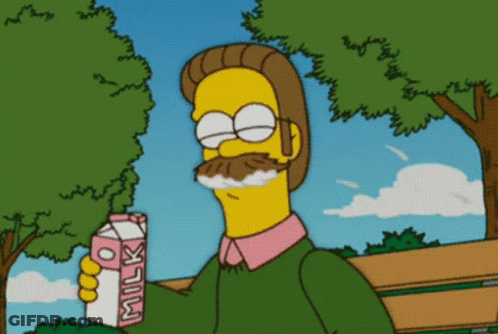 A Cartoon Character Holds A Carton Of Milk In His Hand GIF