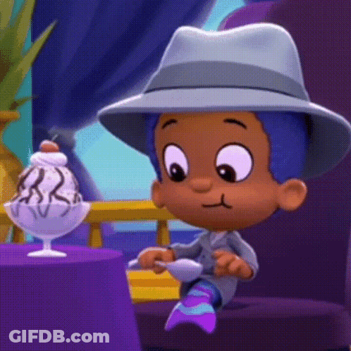 A Cartoon Character In A Hat Sits At A Table With A Bowl Of Ice Cream GIF
