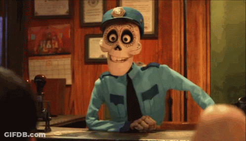 A Cartoon Character In A Police Uniform Is Sitting At A Desk GIF