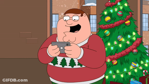 A Cartoon Character In A Red Sweater Is Holding A Cell Phone In Front Of A Christmas Tree GIF