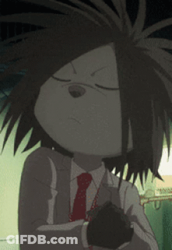 A Cartoon Character In A Suit And Tie Holds A Black Object GIF