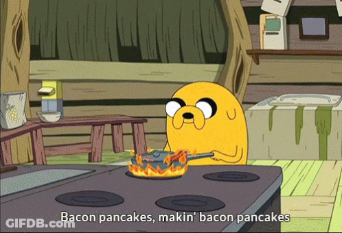 A Cartoon Character Is Cooking Bacon Pancakes On The Stove GIF