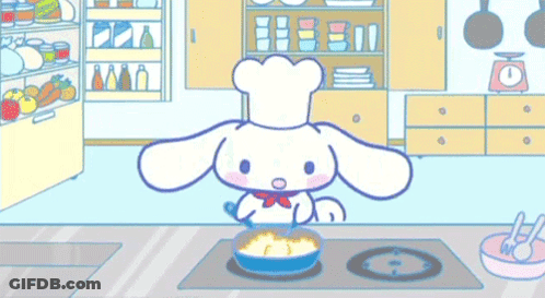 A Cartoon Character Is Cooking Food In A Kitchen . GIF
