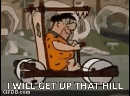 A Cartoon Character Is Driving A Car With The Words `` I Will Get Up That Hill '' Written On It . GIF