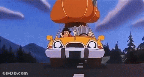 A Cartoon Character Is Driving A Yellow Car With A Pumpkin On The Roof . GIF