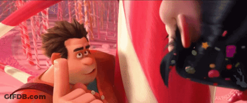 A Cartoon Character Is Giving A Thumbs Up While Standing Next To A Candy Cane . GIF