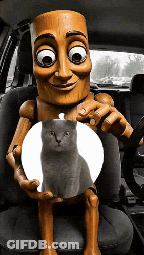 A Cartoon Character Is Holding A Cat In His Hands GIF