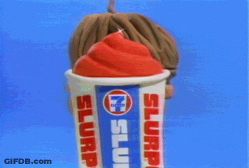 A Cartoon Character Is Holding A Cup Of Slurp Ice Cream GIF