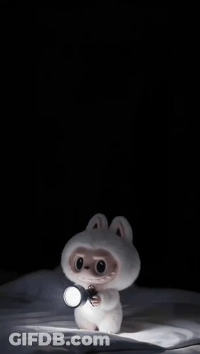 A Cartoon Character Is Holding A Flashlight In Its Hand GIF