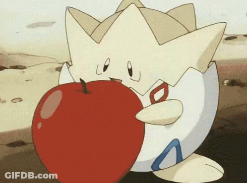 A Cartoon Character Is Holding A Large Red Apple In Its Mouth . GIF
