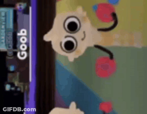 A Cartoon Character Is Holding A Pair Of Boxing Gloves In Front Of A Sign That Says Goob . GIF