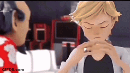 A Cartoon Character Is Holding A Ring In His Hand While Talking To Another Character . GIF