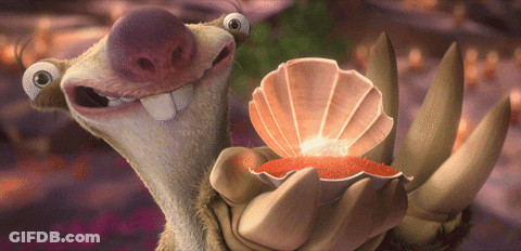 A Cartoon Character Is Holding A Sea Shell In His Hand GIF