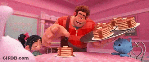 A Cartoon Character Is Holding A Tray Of Pancakes And Pointing At Them GIF