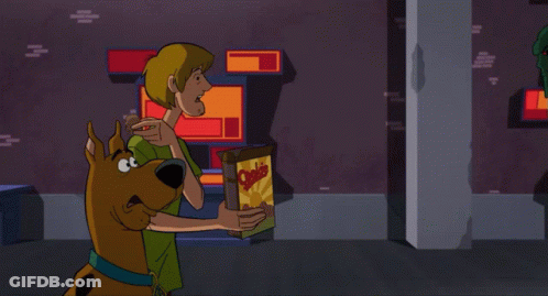 A Cartoon Character Is Holding Something In His Hand And Screaming GIF