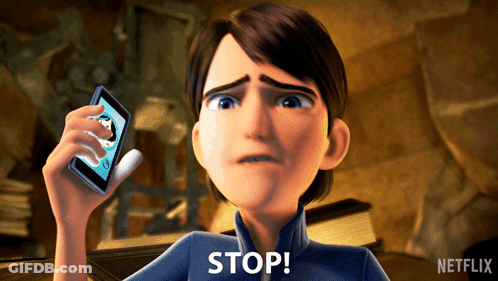 A Cartoon Character Is Holding Up A Cell Phone And Says " Stop " GIF