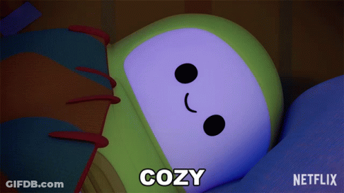 A Cartoon Character Is Laying Down With The Word Cozy Below It GIF