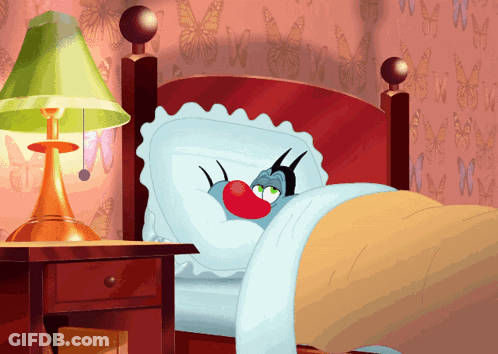 A Cartoon Character Is Laying In A Bed With A Red Nose GIF
