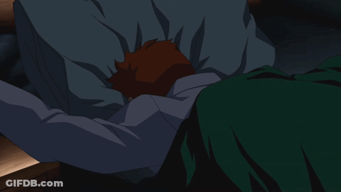 A Cartoon Character Is Laying In A Bed With His Arms Outstretched GIF