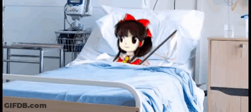 A Cartoon Character Is Laying In A Hospital Bed With A Stick In Her Hand . GIF