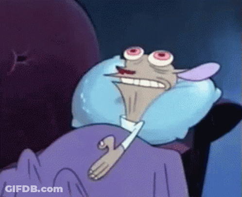 A Cartoon Character Is Laying In Bed With A Blue Pillow GIF