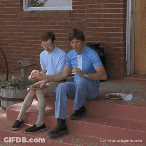 A Cartoon Character Is Laying In The Grass With His Head On His Arms . GIF