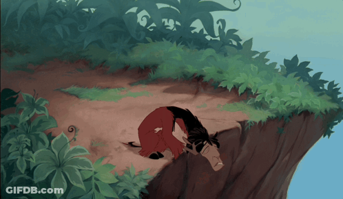 A Cartoon Character Is Laying On A Cliff GIF