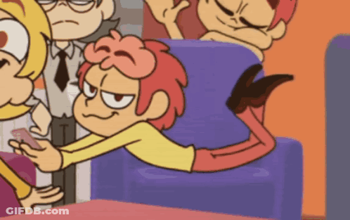 A Cartoon Character Is Laying On A Couch And Looking At His Phone GIF
