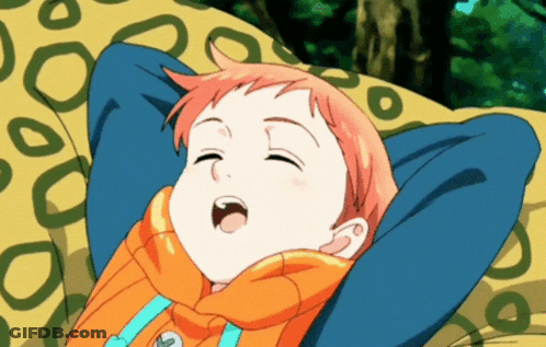 A Cartoon Character Is Laying On A Yellow Blanket With His Eyes Closed GIF