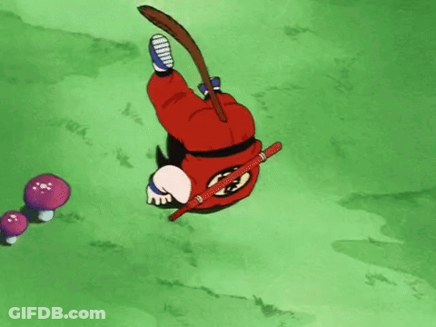A Cartoon Character Is Laying On His Back In The Grass With A Stick In His Hand . GIF