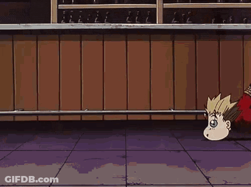 A Cartoon Character Is Laying On The Floor With His Head In The Air . GIF