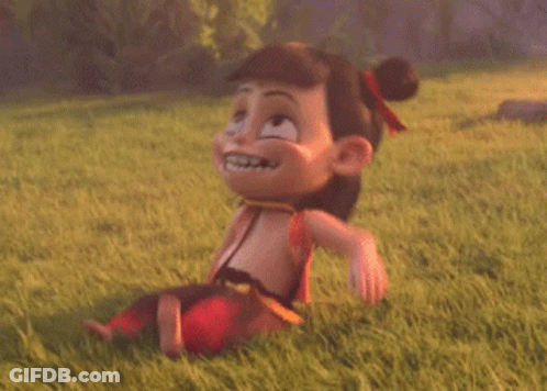 A Cartoon Character Is Laying On The Grass Laughing . GIF