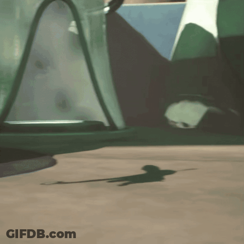 A Cartoon Character Is Laying On The Ground In Front Of A Green Vehicle GIF