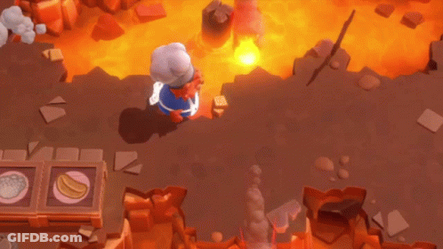 A Cartoon Character Is Laying On The Ground In Front Of A Large Fire GIF