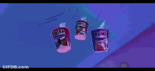 A Cartoon Character Is Laying On The Ground Reaching For A Cup Of Rumi GIF