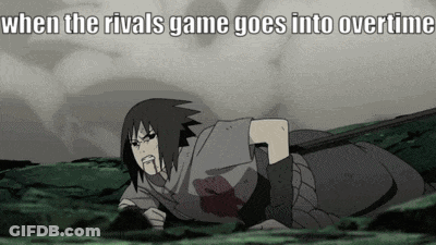 A Cartoon Character Is Laying On The Ground With A Sword In His Hand . GIF