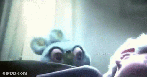 A Cartoon Character Is Looking At A Person 'S Face In A Mirror . GIF